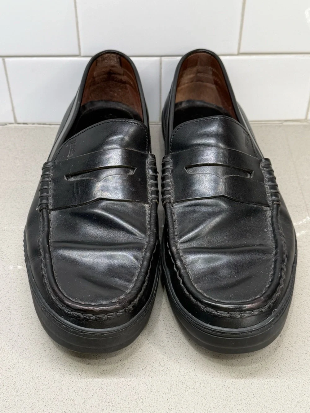 Tod's Black Leather Penny Loafers for Men